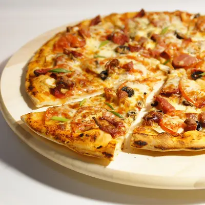 Wood-fired pizza sliced on a board