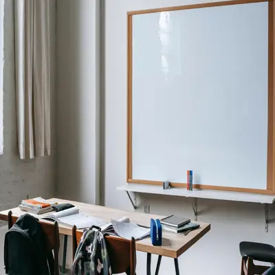 Classroom with desks and a whiteboard