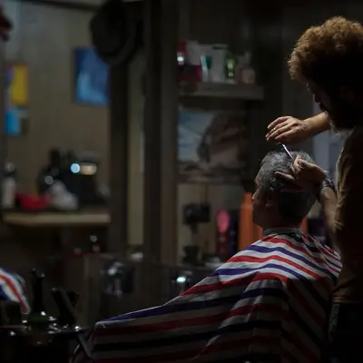 Barber cutting a customer’s hair