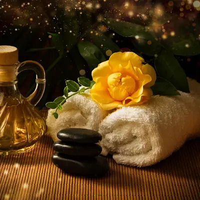 Hot stones and towels by candlelight